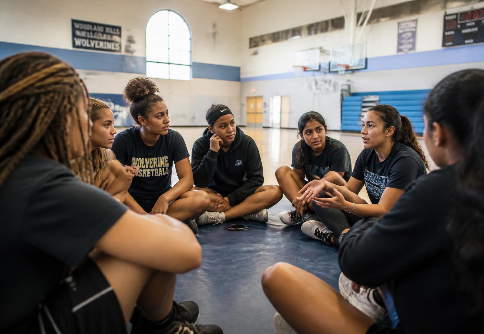 Young women seated in a circle during a leadership discussion